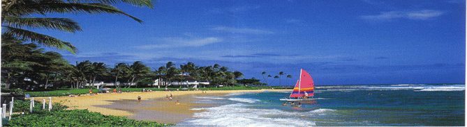 A catamaran sailing off Poipu Beach near Kiahuna Plantation